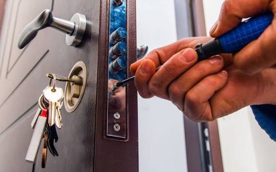 Locksmith servicing a lock